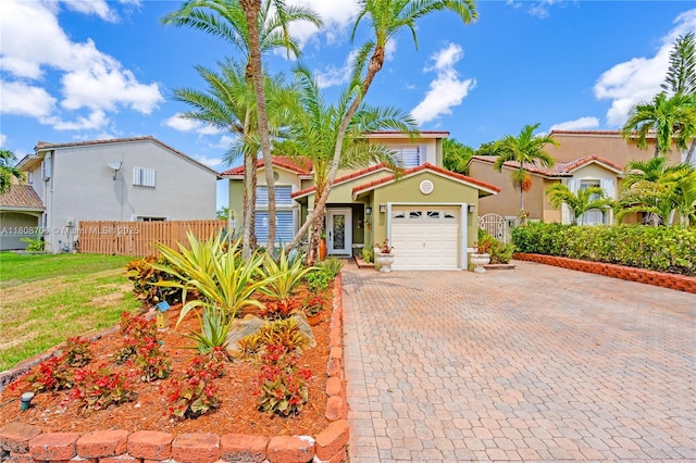 10213 SW 156th Ave, Miami, FL 33196 - view of front of home featuring an attached garage, decorative driveway, and stucco siding