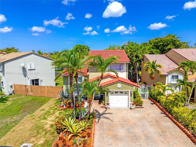 10213 SW 156th Ave, Miami, FL 33196 - view of front of house with a tile roof, a gate, decorative driveway, stucco siding, and a garage