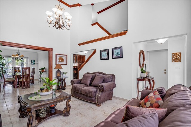 10213 SW 156th Ave, Miami, FL 33196 - tiled living area featuring a chandelier, a high ceiling, and ornamental molding