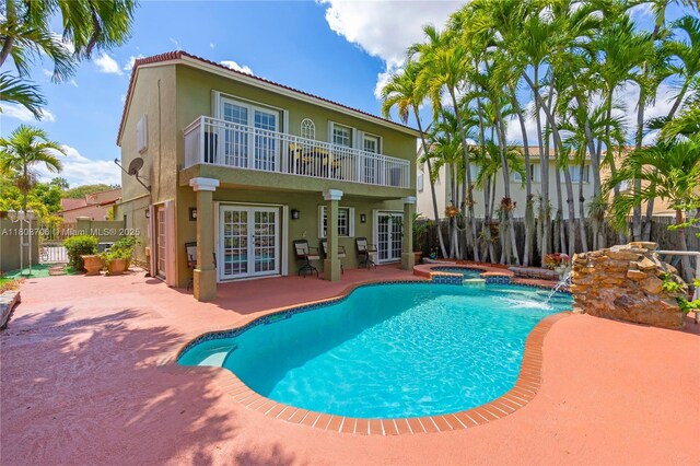 10213 SW 156th Ave, Miami, FL 33196 - view of swimming pool featuring french doors, a patio, a fenced backyard, and a pool with connected hot tub