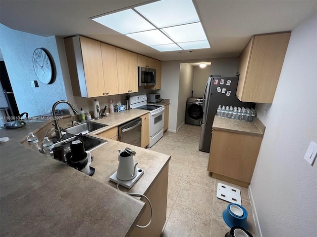 9144 W Atlantic Blvd Unit 832, Coral Springs, FL 33071 - kitchen with stainless steel appliances, washer / dryer, light brown cabinetry, and light tile patterned floors
