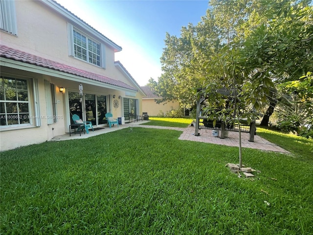 2220 NW 137th Ave, Sunrise, FL 33323 - view of grassy yard featuring a patio area