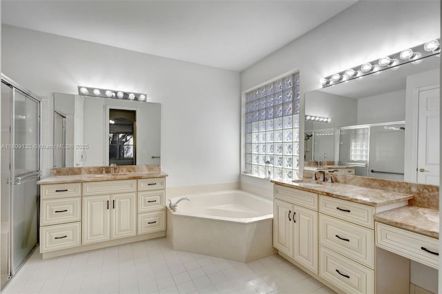 11564 Puerto Blvd, Boynton Beach, FL 33437 - bathroom featuring a shower stall, a bath, two vanities, and tile patterned floors