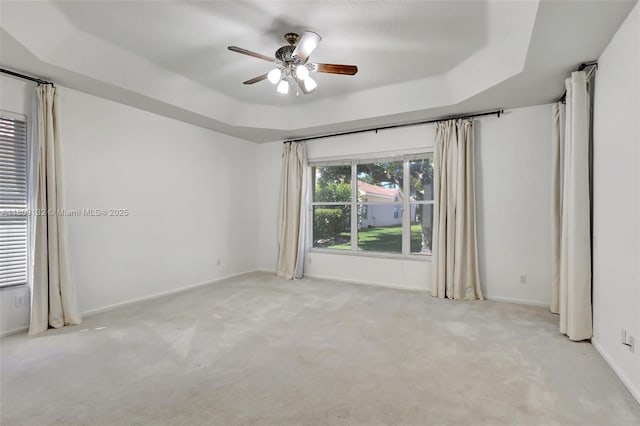 11564 Puerto Blvd, Boynton Beach, FL 33437 - carpeted empty room featuring a tray ceiling, a ceiling fan, and baseboards