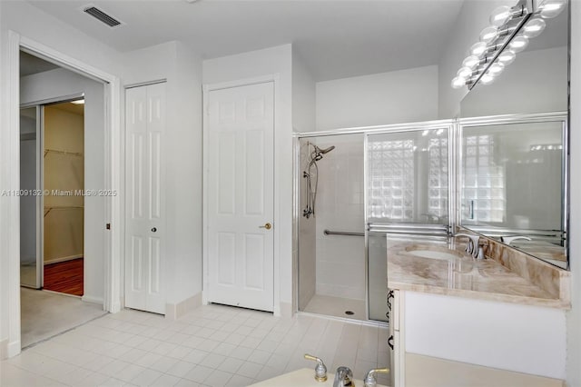 11564 Puerto Blvd, Boynton Beach, FL 33437 - bathroom with a shower stall, tile patterned flooring, and vanity