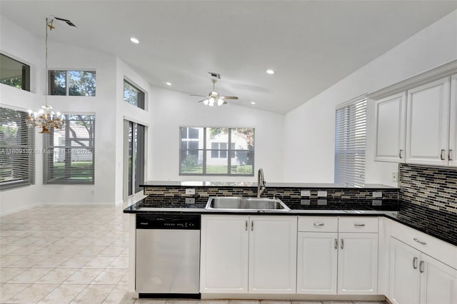 11564 Puerto Blvd, Boynton Beach, FL 33437 - kitchen with dishwasher, a sink, decorative backsplash, a chandelier, and lofted ceiling