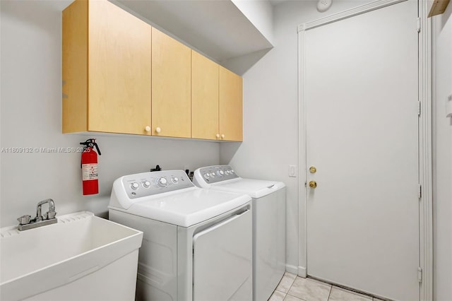 11564 Puerto Blvd, Boynton Beach, FL 33437 - laundry area featuring cabinet space, separate washer and dryer, and light tile patterned floors
