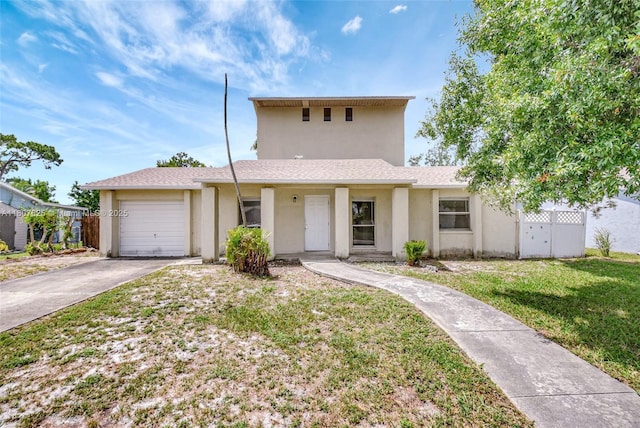 6160 Camp Lee Rd, West Palm Beach, FL 33417 - view of front of home with concrete driveway, an attached garage, and stucco siding