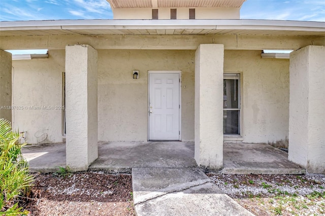 6160 Camp Lee Rd, West Palm Beach, FL 33417 - entrance to property featuring stucco siding