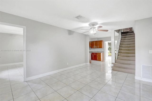 6160 Camp Lee Rd, West Palm Beach, FL 33417 - unfurnished living room with stairs, a ceiling fan, light tile patterned flooring, and baseboards