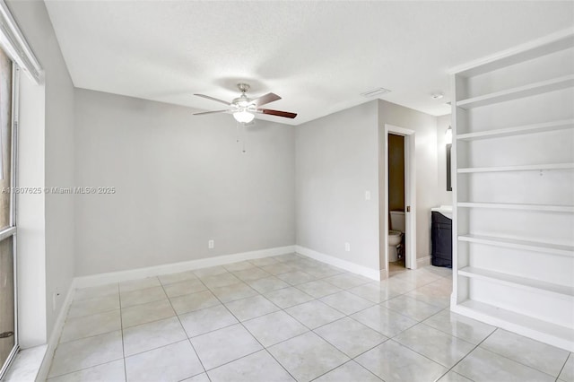 6160 Camp Lee Rd, West Palm Beach, FL 33417 - unfurnished room with ceiling fan, light tile patterned floors, and baseboards