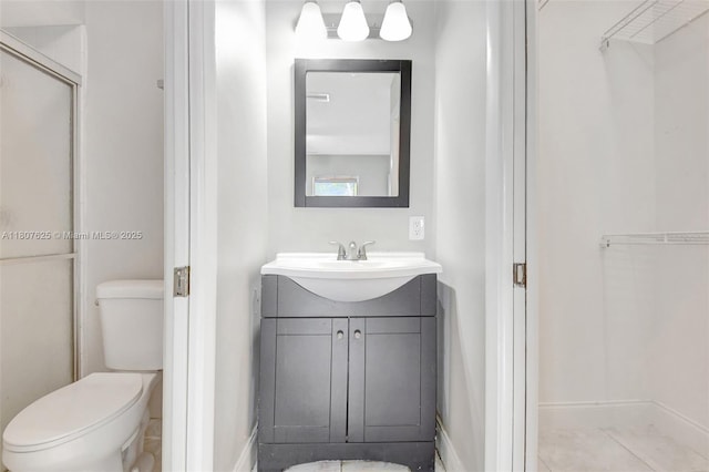 6160 Camp Lee Rd, West Palm Beach, FL 33417 - full bath with vanity, toilet, a shower with door, and baseboards