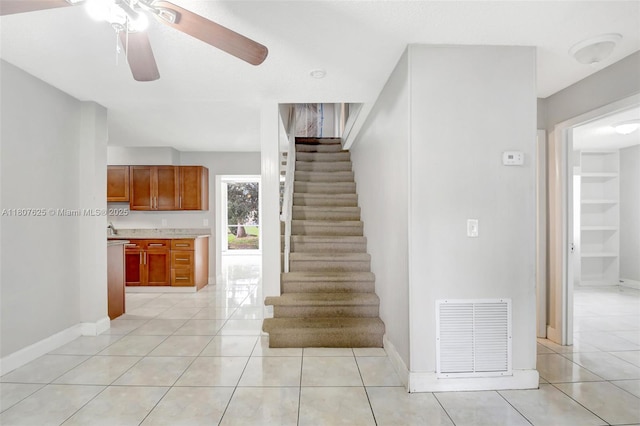 6160 Camp Lee Rd, West Palm Beach, FL 33417 - staircase with ceiling fan, tile patterned floors, and baseboards
