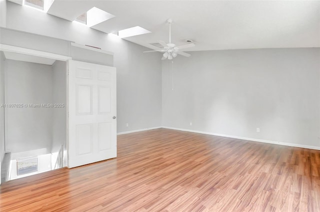 6160 Camp Lee Rd, West Palm Beach, FL 33417 - spare room featuring a skylight, light wood finished floors, baseboards, and ceiling fan