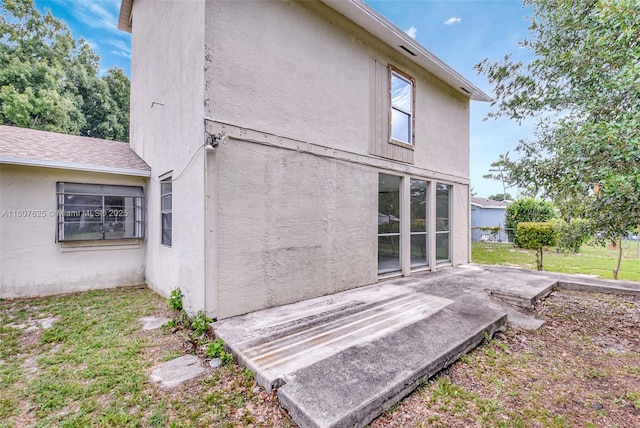 6160 Camp Lee Rd, West Palm Beach, FL 33417 - rear view of house featuring stucco siding