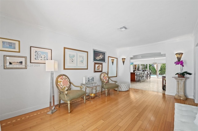 1771 Wa Kee Na Dr, Miami, FL 33133 - sitting room with arched walkways, ornamental molding, light wood-type flooring, and baseboards