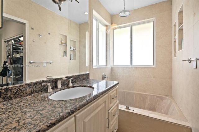 1771 Wa Kee Na Dr, Miami, FL 33133 - bathroom featuring vanity, a spacious closet, shower / bathtub combination, and tile walls