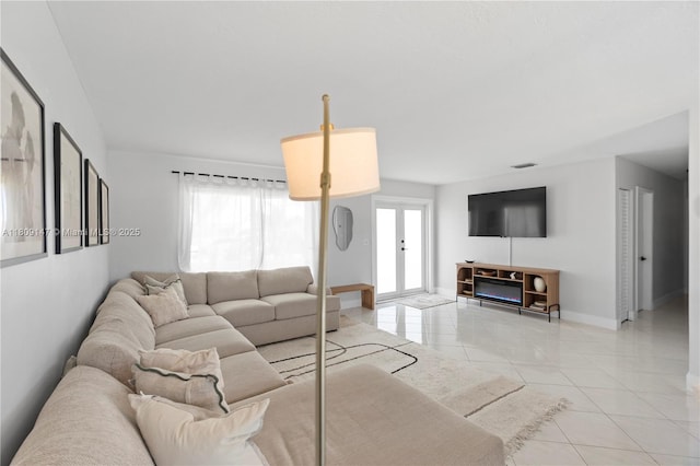 8930 SW 50th Ter, Miami, FL 33165 - living room featuring baseboards and light tile patterned floors