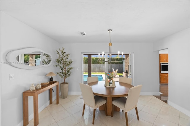8930 SW 50th Ter, Miami, FL 33165 - dining area with a chandelier, baseboards, and light tile patterned floors