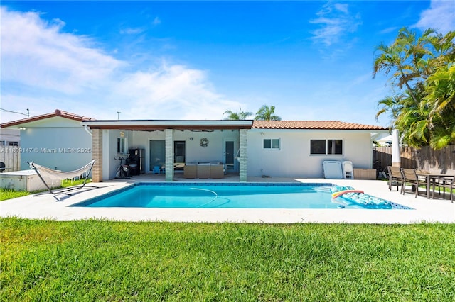 8930 SW 50th Ter, Miami, FL 33165 - back of house featuring outdoor lounge area, a patio area, stucco siding, and a tile roof
