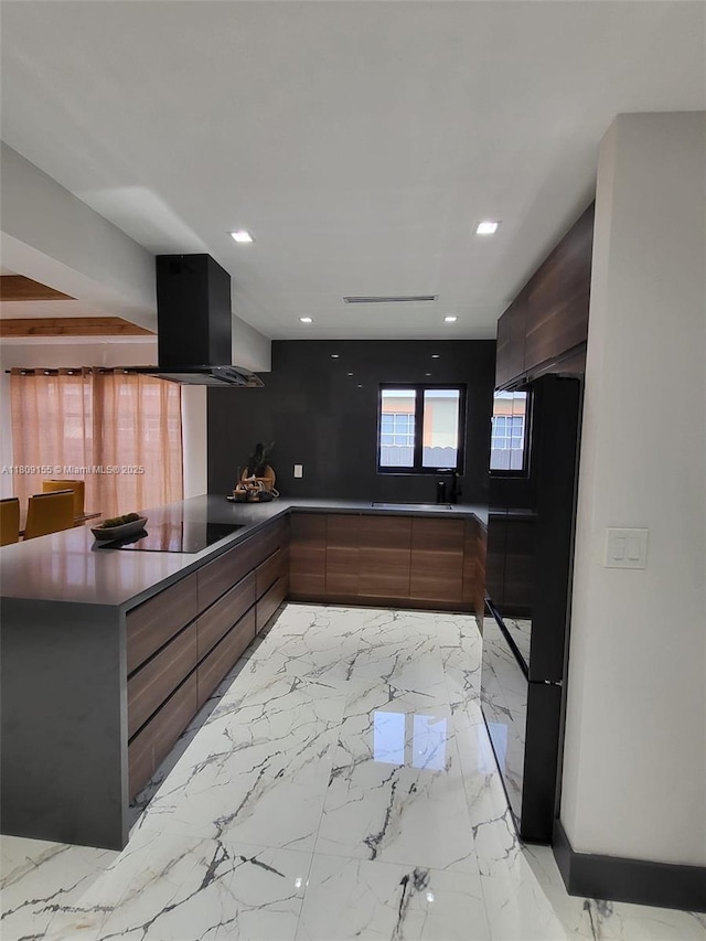 7672 La Salle Blv, Miramar, FL 33023 - kitchen featuring modern cabinets, black electric cooktop, wall chimney exhaust hood, recessed lighting, and a peninsula