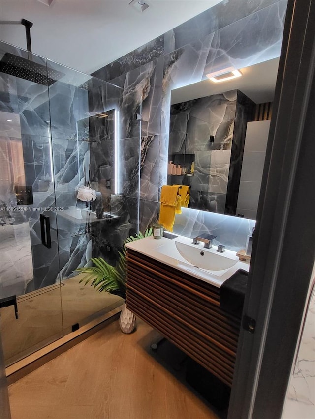 7672 La Salle Blv, Miramar, FL 33023 - bathroom featuring a marble finish shower, tile walls, and vanity