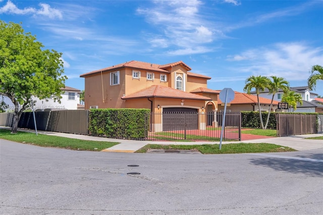5972 SW 163rd Pl, Miami, FL 33193 - mediterranean / spanish-style home featuring a tile roof, stucco siding, an attached garage, and driveway