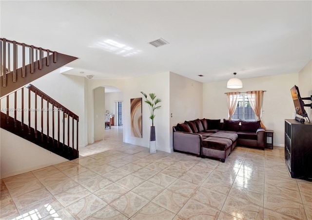 5972 SW 163rd Pl, Miami, FL 33193 - living area featuring arched walkways, stairs, and light tile patterned floors