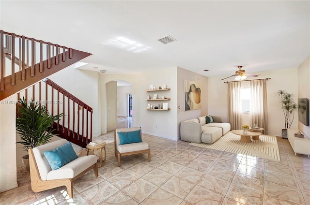 5972 SW 163rd Pl, Miami, FL 33193 - living area with arched walkways, stairway, and a ceiling fan