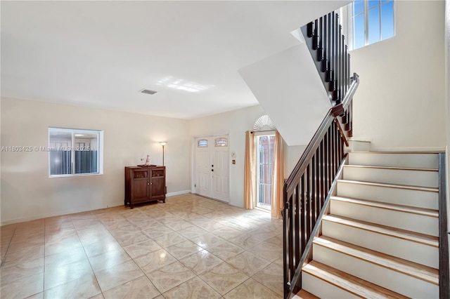 5972 SW 163rd Pl, Miami, FL 33193 - entryway featuring stairway and baseboards