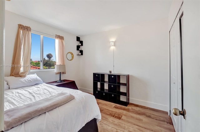 5972 SW 163rd Pl, Miami, FL 33193 - bedroom featuring baseboards and light wood-style flooring