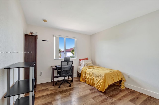 5972 SW 163rd Pl, Miami, FL 33193 - bedroom featuring wood finished floors and baseboards