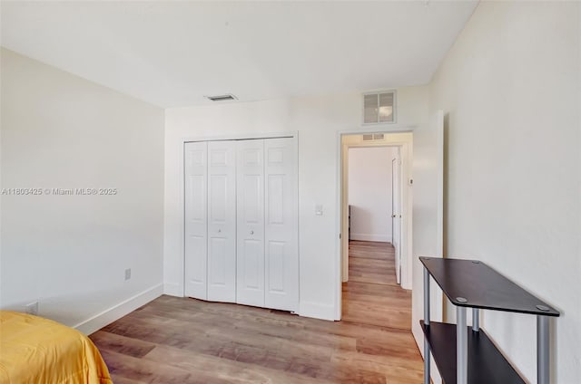5972 SW 163rd Pl, Miami, FL 33193 - unfurnished bedroom with wood finished floors, baseboards, and a closet