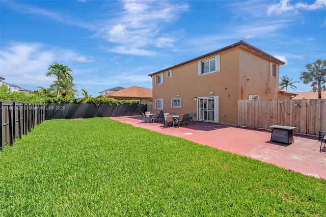 5972 SW 163rd Pl, Miami, FL 33193 - rear view of house with stucco siding and a patio area