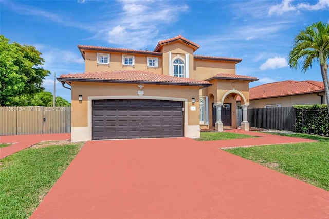 5972 SW 163rd Pl, Miami, FL 33193 - mediterranean / spanish-style house featuring stucco siding, an attached garage, concrete driveway, a gate, and a tile roof