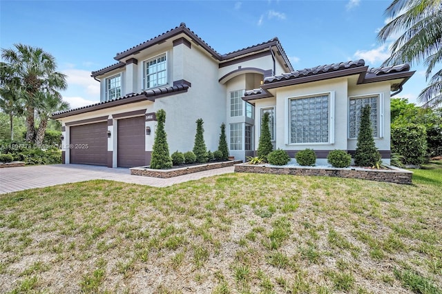 5466 SW 187th Ter, Miramar, FL 33029 - mediterranean / spanish-style house with an attached garage, driveway, a front yard, and stucco siding