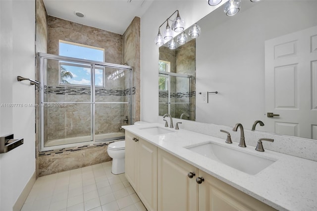 5466 SW 187th Ter, Miramar, FL 33029 - bathroom featuring toilet, enclosed tub / shower combo, double vanity, and tile patterned flooring