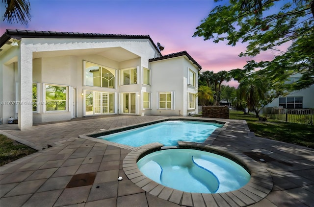5466 SW 187th Ter, Miramar, FL 33029 - view of pool with a pool with connected hot tub and a patio