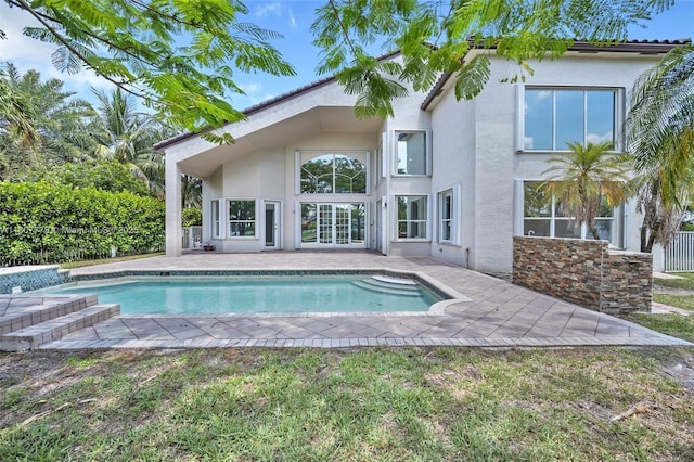 5466 SW 187th Ter, Miramar, FL 33029 - back of property featuring stucco siding, a patio area, and an outdoor pool