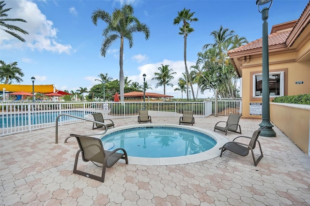 5466 SW 187th Ter, Miramar, FL 33029 - community pool featuring a patio