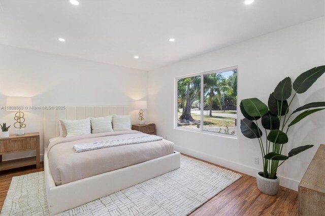 5492 Barnstead Cir, Lake Worth, FL 33463 - bedroom with wood finished floors, recessed lighting, and baseboards