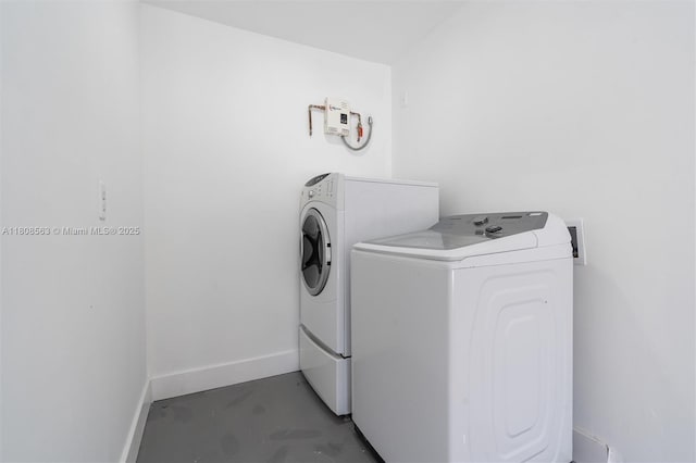 5492 Barnstead Cir, Lake Worth, FL 33463 - laundry area featuring washer and dryer and baseboards