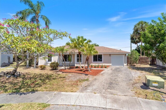 5492 Barnstead Cir, Lake Worth, FL 33463 - ranch-style home featuring concrete driveway and a garage