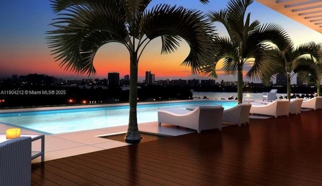 9940 W Bay Harbor Dr Unit 4E-S, Bay Harbor Islands, FL 33154 - pool at dusk with a community pool, a view of city, and a deck