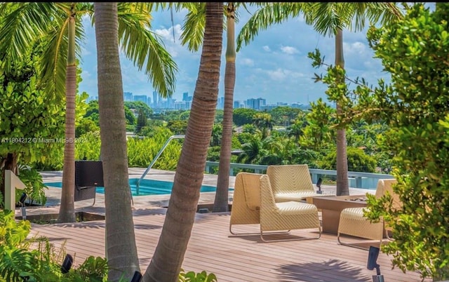 9940 W Bay Harbor Dr Unit 4E-S, Bay Harbor Islands, FL 33154 - swimming pool featuring a deck and a city view
