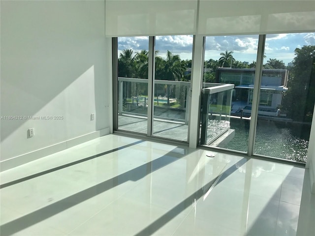 9940 W Bay Harbor Dr Unit 4E-S, Bay Harbor Islands, FL 33154 - empty room with tile patterned floors