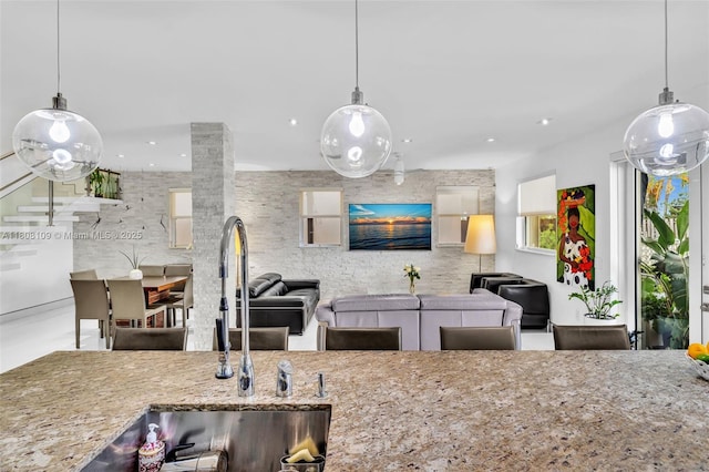 4362 NW 112th Ct, Doral, FL 33178 - kitchen featuring a sink, stone counters, open floor plan, and recessed lighting