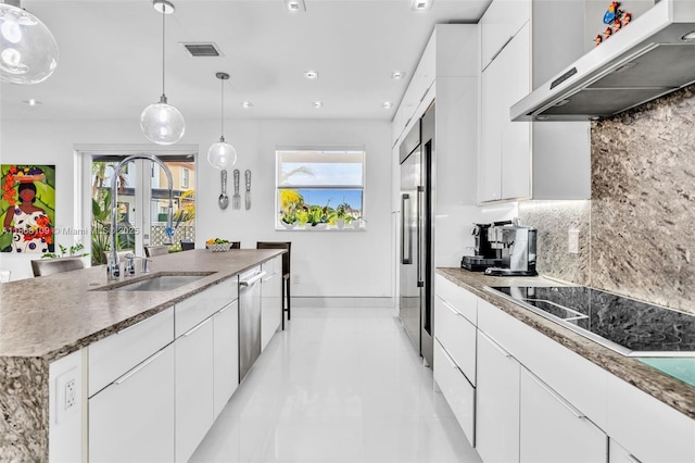 4362 NW 112th Ct, Doral, FL 33178 - kitchen featuring under cabinet range hood, a sink, tasteful backsplash, stainless steel appliances, and healthy amount of natural light