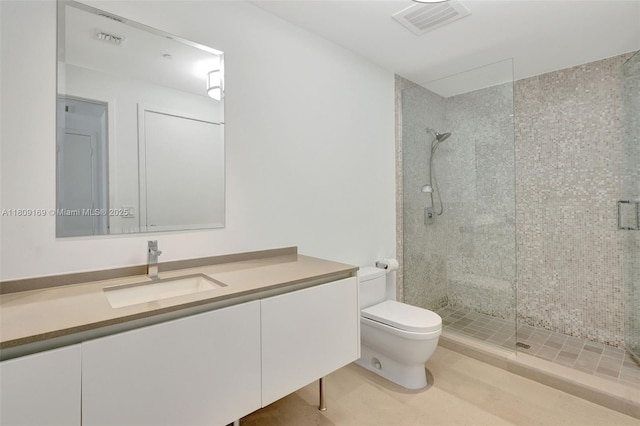 68 SE 6th St Unit 1203, Miami, FL 33131 - bathroom with toilet, a stall shower, and vanity