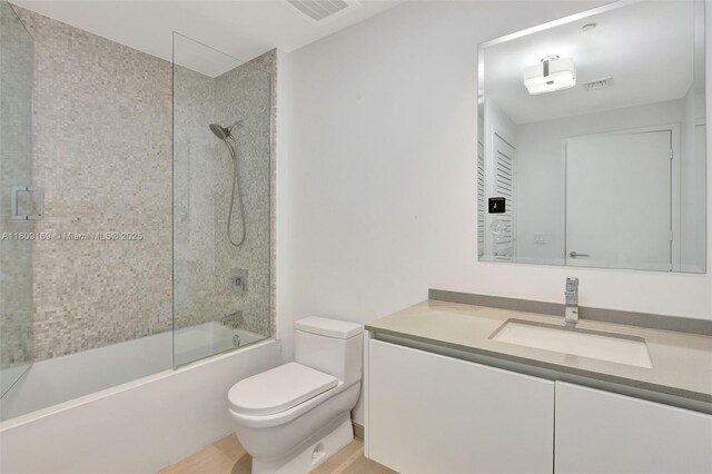 68 SE 6th St Unit 1203, Miami, FL 33131 - full bath with toilet, vanity, and combined bath / shower with glass door